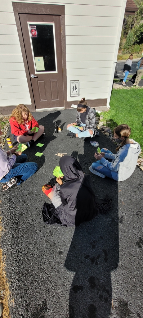 kids playing cards outside